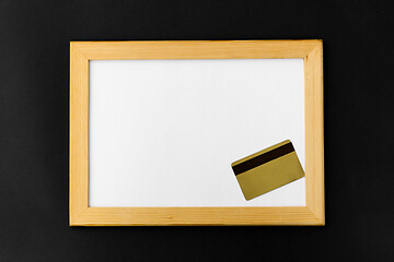 Image showing white magnetic board and credit card on black