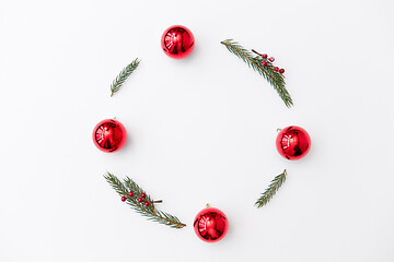 Image showing christmas frame of fir branches with red balls