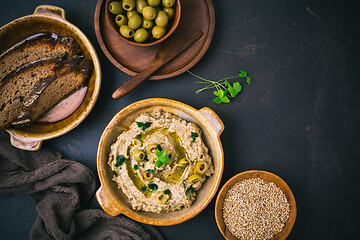 Image showing Arabic Aubergine paste or dip Baba Ghanoush with olives and sesame seeds