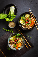 Image showing Asia style ramen soup with udon noodle, beef, shiitake, pak choi cabbage and carrots