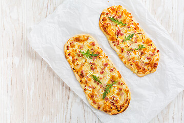 Image showing Tarte Flambee - flat bread (Flammkuchen) with bacon, onion, champignon and cheese