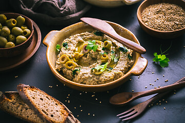 Image showing Arabic Aubergine paste or dip Baba Ghanoush with olives and sesame seeds