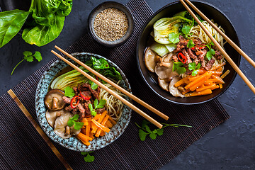 Image showing Asia style ramen soup with udon noodle, beef, shiitake, pak choi cabbage and carrots