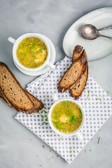 Image showing Homemade egg soup with fresh sourdough bread