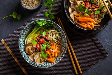 Image showing Asia style ramen soup with udon noodle, beef, shiitake, pak choi cabbage and carrots