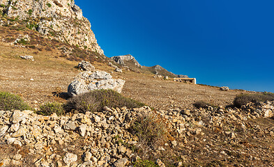 Image showing Landscape with rocky ground, rock, wall and house. Sicily