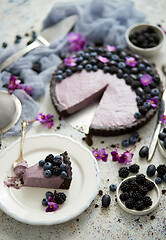 Image showing Plate with homemade piece of delicious blueberry, blackberry and grape pie or tart served on table