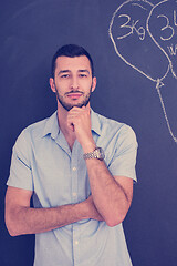 Image showing portrait of man in front of black chalkboard