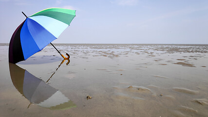 Image showing Colorful umbrella and reflection 