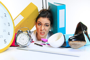 Image showing Young woman getting a lot of work and deadline