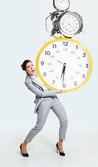Image showing Young woman can\'t organize her worktime