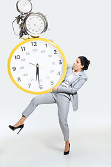 Image showing Young woman can\'t organize her worktime