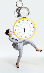 Image showing Young woman can\'t organize her worktime