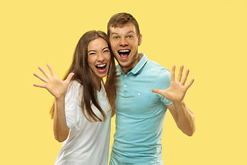 Image showing Beautiful couple isolated on yellow studio background