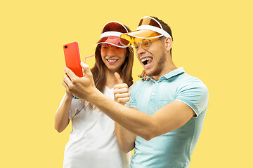 Image showing Beautiful couple isolated on yellow studio background