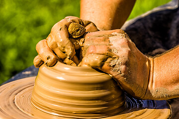 Image showing Potters hands working on new project