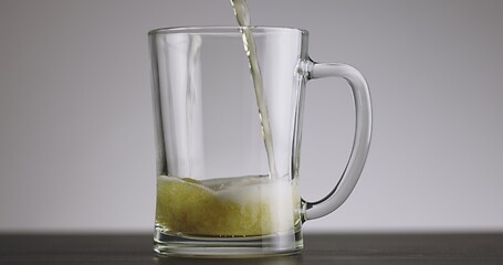 Image showing Pouring beer into big mug until its full timelapse footage