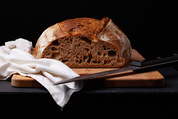 Image showing Artisan sourdough bread. on the black background. 