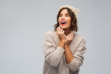 Image showing young woman in knitted winter hat and sweater