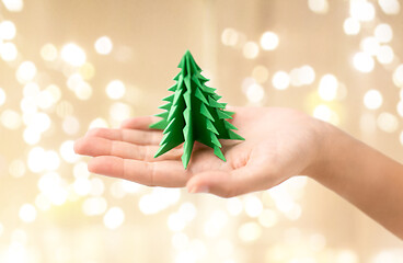 Image showing hand holding green paper origami christmas tree