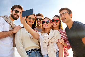 Image showing happy friends taking selfie in summer