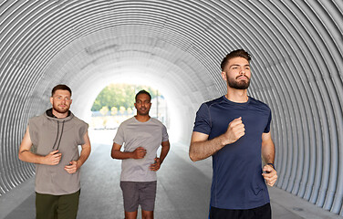 Image showing young men or male friends running outdoors