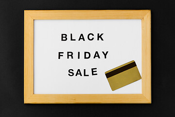 Image showing board with black friday sale words and credit card