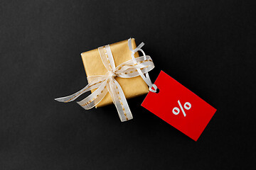 Image showing small gift box and red sale tag with discount sign