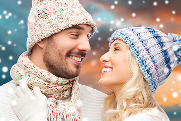 Image showing smiling couple in winter clothes hugging