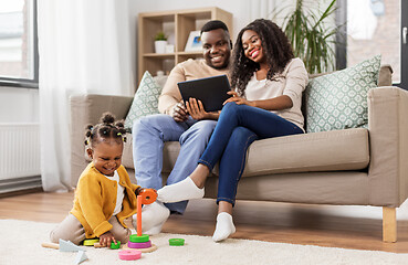 Image showing african baby girl playing with toy blocks at home