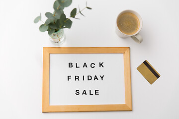 Image showing board with black friday sale words and credit card