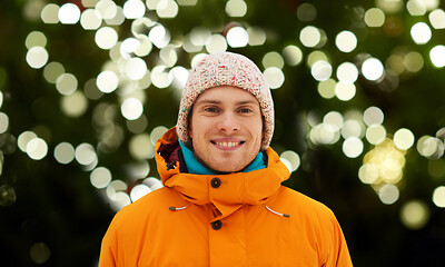 Image showing happy young man in winter clothes outdoors