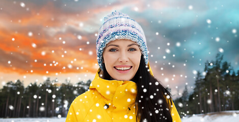 Image showing happy young woman in winter clothes outdoors