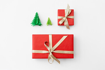 Image showing gift boxes and christmas trees on white background