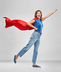 Image showing happy woman in red superhero cape