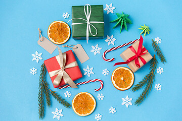 Image showing christmas gifts, branches, tags and decorations