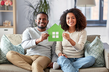 Image showing happy african american couple on sofa at home