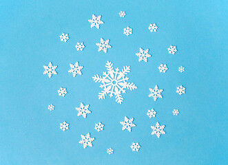 Image showing white snowflake decorations on blue background