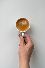 Image showing Man holding cup of coffee