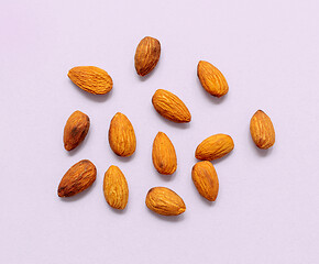 Image showing almonds on light purple background