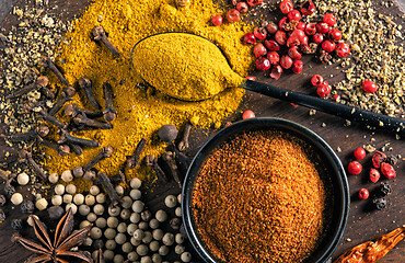 Image showing various spices on wooden table