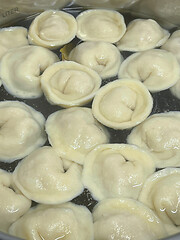 Image showing Cooking dumplings in boiling water