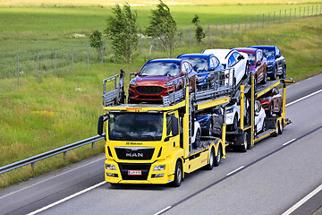 Image showing Yellow MAN TGS Car Carrier Hauls New Cars 