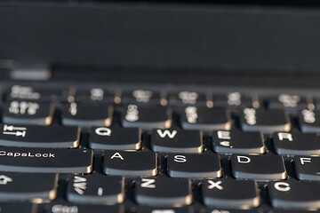 Image showing Macro shot of laptop with black keyboard