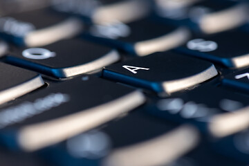 Image showing Macro shot of black keyboard focus on A key