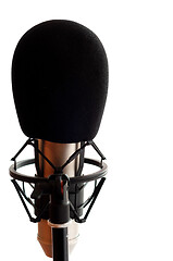 Image showing Close up of microphone in studio room, isolated on white