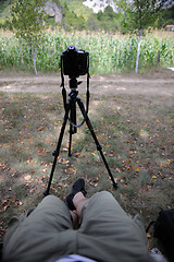 Image showing pov photographer in nature taking timelapse photo on pro dslr ca