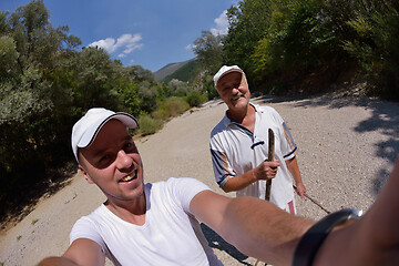 Image showing dad and son taking selfie photos