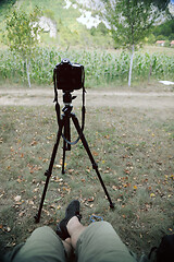 Image showing pov photographer in nature taking timelapse photo on pro dslr ca