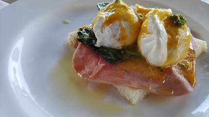 Image showing Eggs Benedict and toasted bread with spinach 